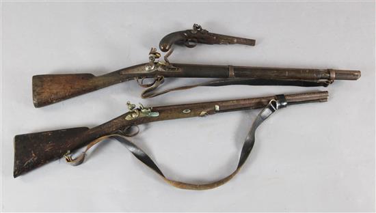 A 19th century flintlock pistol and two flintlock rifles / muskets